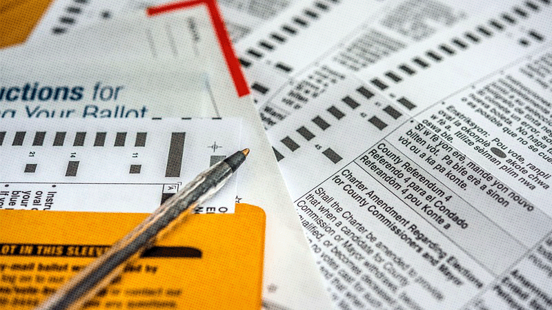 Close up image of an election ballot with a pen.